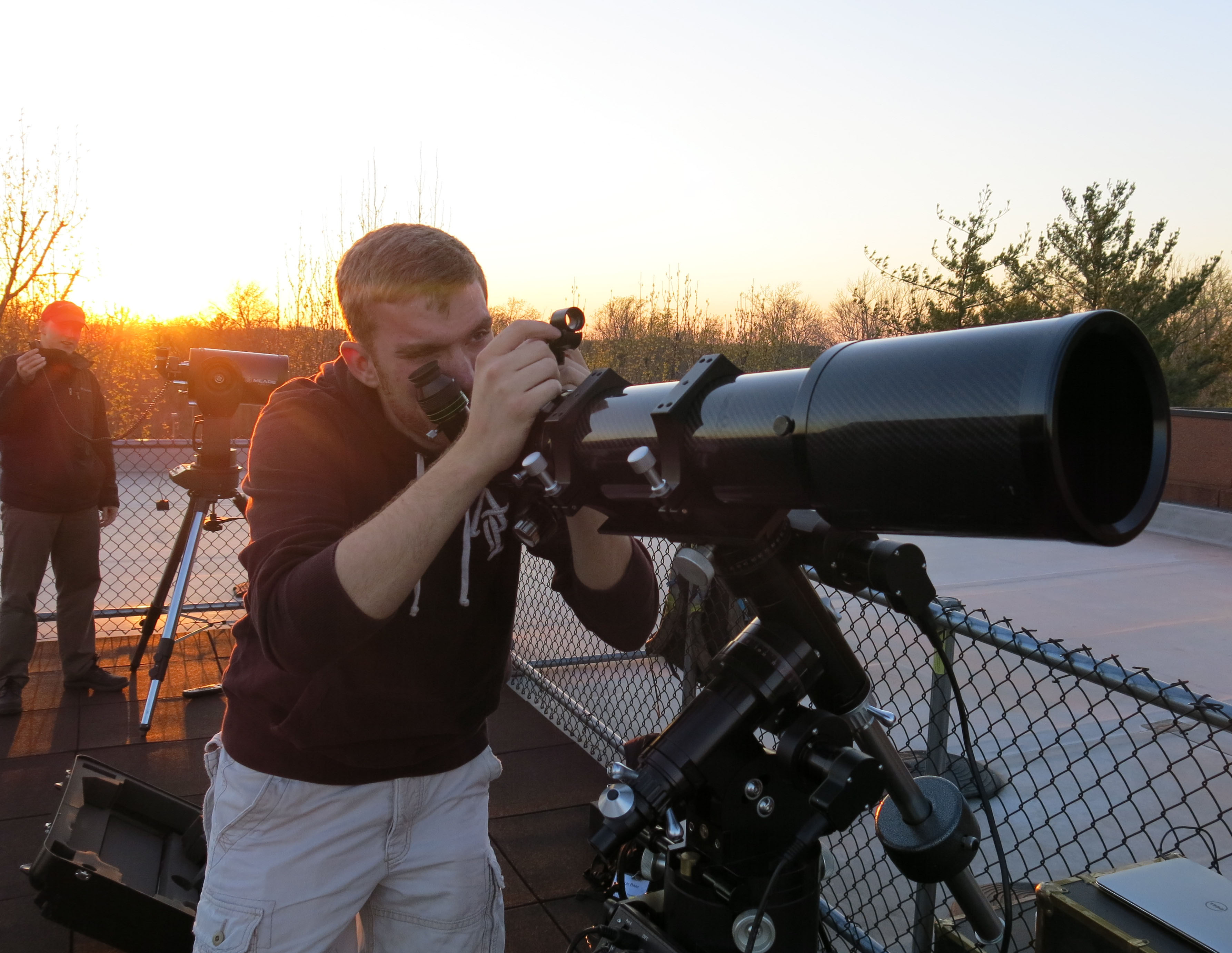 SIU Student with a telescope