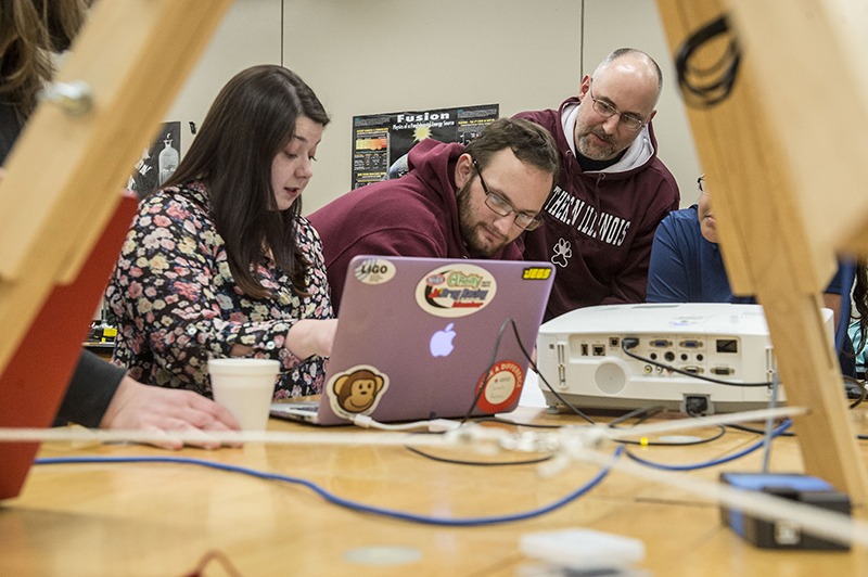 SIU physics student working together in a classroom